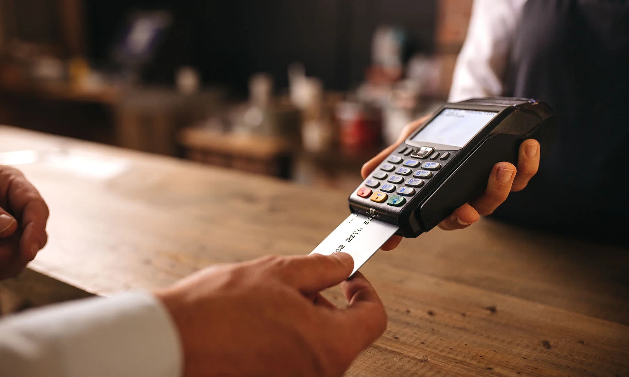 Photo — new debit card in hand